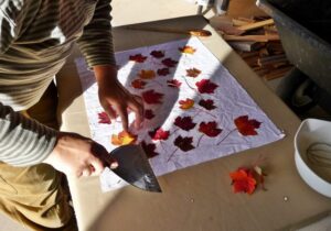 Applying leaves to prepared fabric