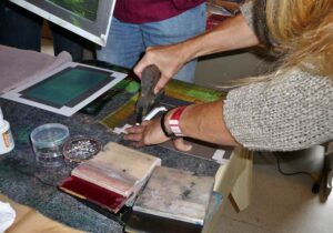 Screen printing images onto the piece