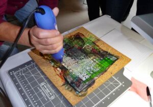 Burning through layers using a heat gun